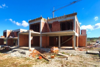 A villa with a pool in a luxury gated community with a sea view - under construction