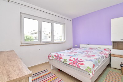 Prostran stan u prizemlju s dvije spavaće sobe i vrtom od 150 m² 10