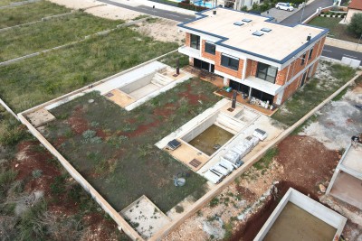 Casa bifamiliare con tre camere da letto e vista panoramica sul mare - nella fase di costruzione 1