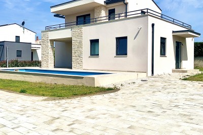 A beautiful villa with a swimming pool and a view of untouched nature 1