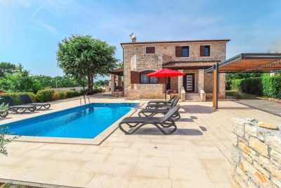 A beautiful stone villa with a swimming pool