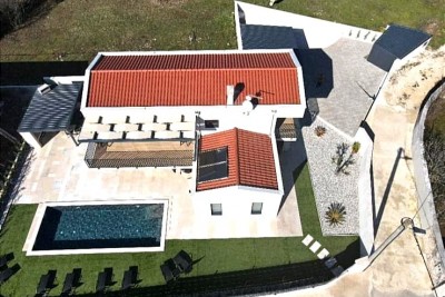 A new house with a swimming pool in a quiet location
