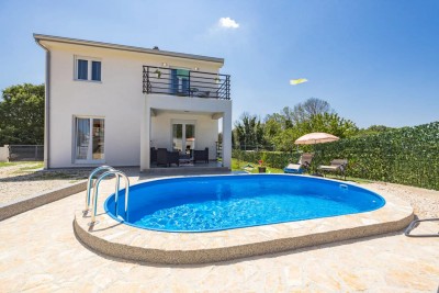 A new furnished house with a swimming pool in a quiet location near Poreč