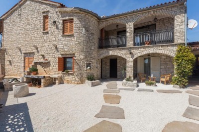 Stone house in a row with three apartments