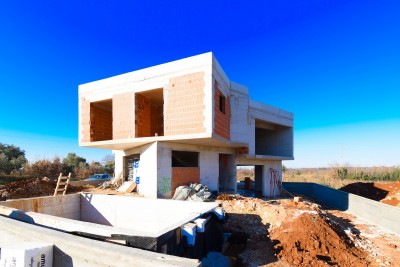 An unusual designer house with a swimming pool in an idyllic location - under construction 3